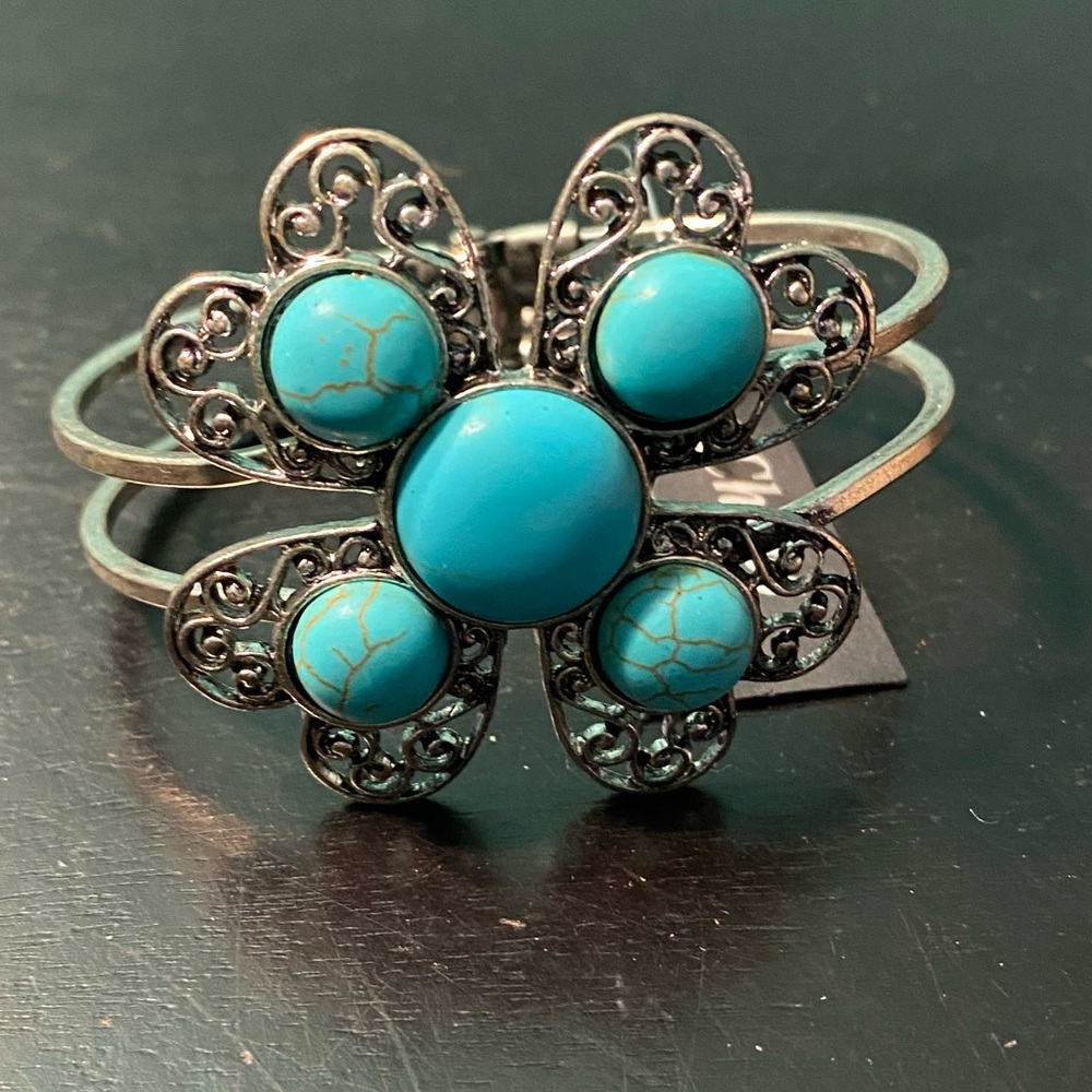 Flower shaped turquoise inspired cuff bracelet.